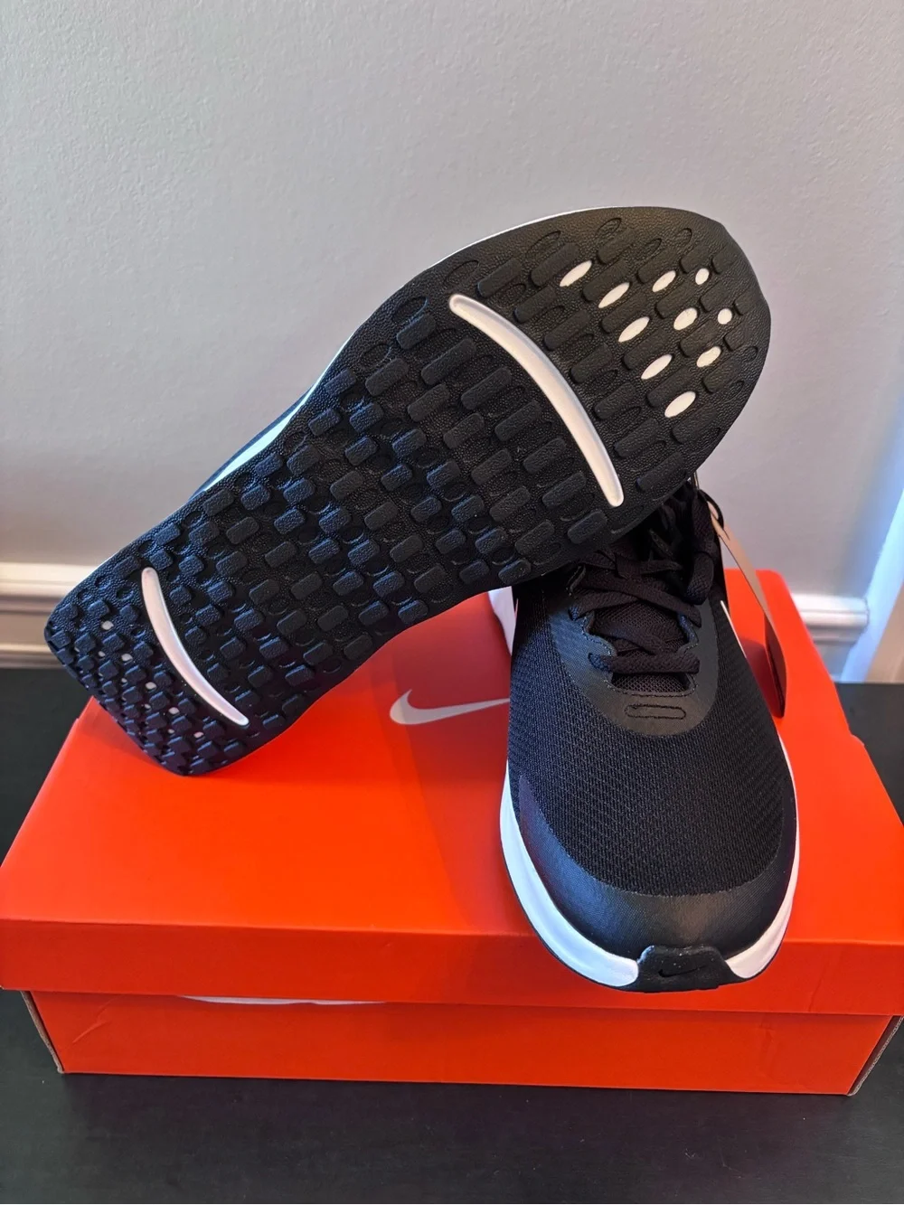 Women’s Nike Promina Black and White Running Sneakers with White Swoosh